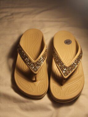 Croc flip flops. Size 7 wide. New.